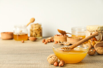 Concept of tasty and sweet food - honey with nuts