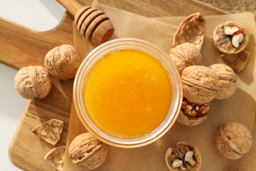 Concept of tasty and sweet food - honey with nuts