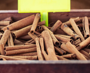 cinnamon in the form of dried bark as a background.