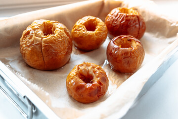 Baked apples in sugar syrup