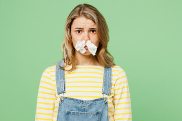 Sick unhealthy ill allergic woman has red watery eyes runny stuffy sore nose suffer from allergy...