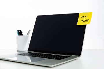 Tax time text on the laptop