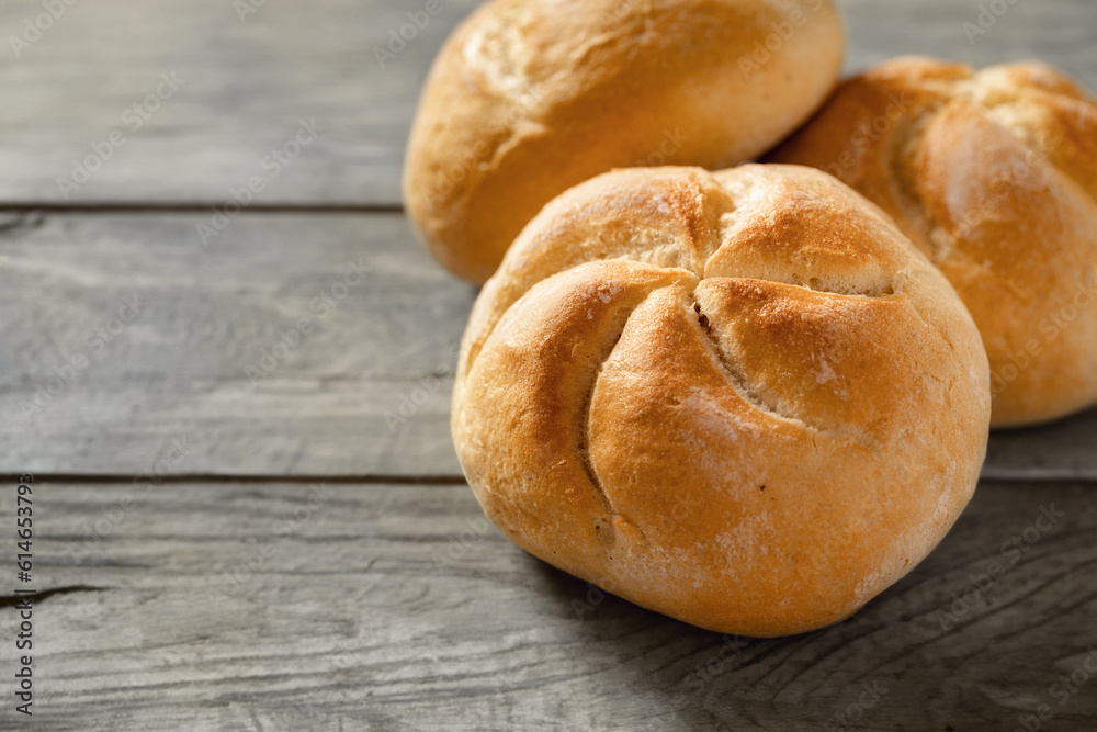 Aufkleber set of fresh small bun bread on the wooden table with copy space
