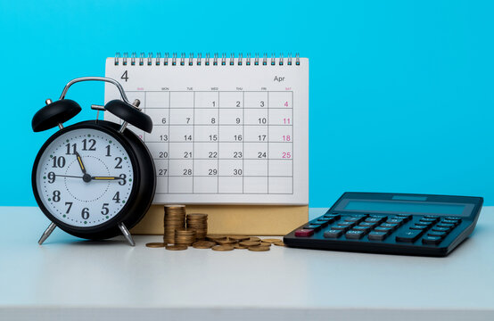 Alarm clock and calendar on office table