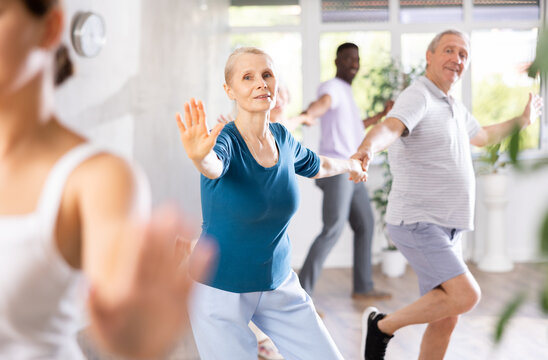 Senior europian man is enjoying his hobby of dancing salsa with his elderly partner at fitness class, relishing in movement and activity. It great way for them to stay active and have fun together.