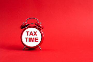 Alarm clock face with text tax time