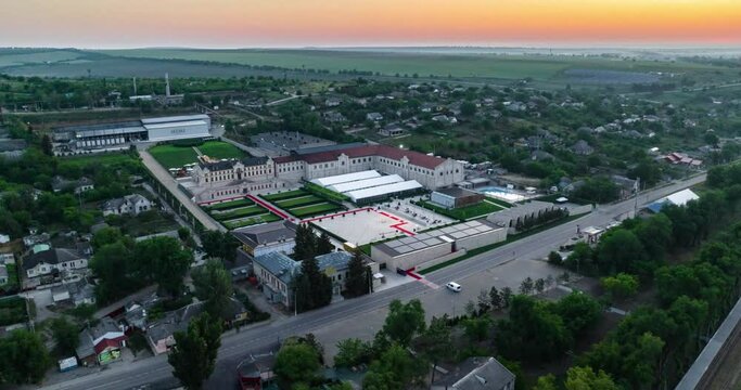 aerial orbit hyperlapse of mimi cstle with red carpet during sunrise