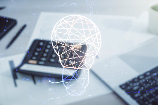 Double exposure of creative light bulb hologram on blurry calculator with laptop background, research and development concept