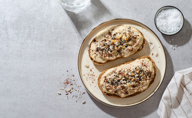 Hummus Toast with Rustic Bread, Vegetarian Snack or Breakfast on Bright Background