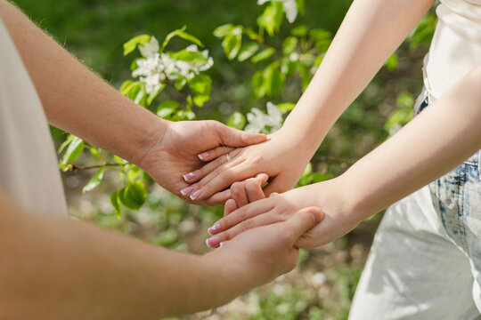 Young couple holding hands at park - Powered by Adobe
