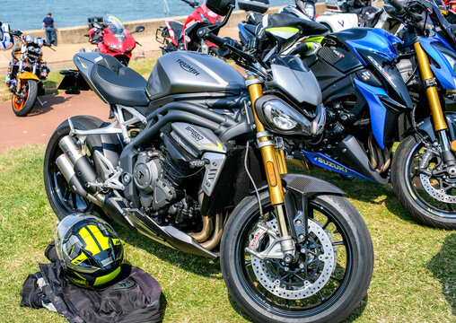 Triumph Speed Triple motorcycle parked up on Hunstanton seafront on the North Norfolk coast. Captured on a bright and sunny afternoon