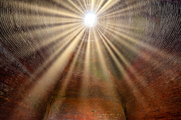 Abstract sunlight through the old abandoned brick kiln creates a mysterious look. Brick kiln manual method of making bricks in the 19th century in Vietnam