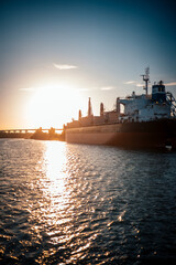 Ship travel to destination on sunset river road  © Dimitar
