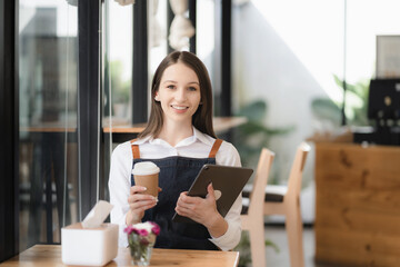 Startups Successful Entrepreneurs Small Businesses Female SME business owner sitting looking up in coffee shop restaurant portrait of successful young girl barista.
