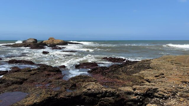 Wild beach with waves breaking on rocks, North Coast, Kwazulu Natal South Africa
