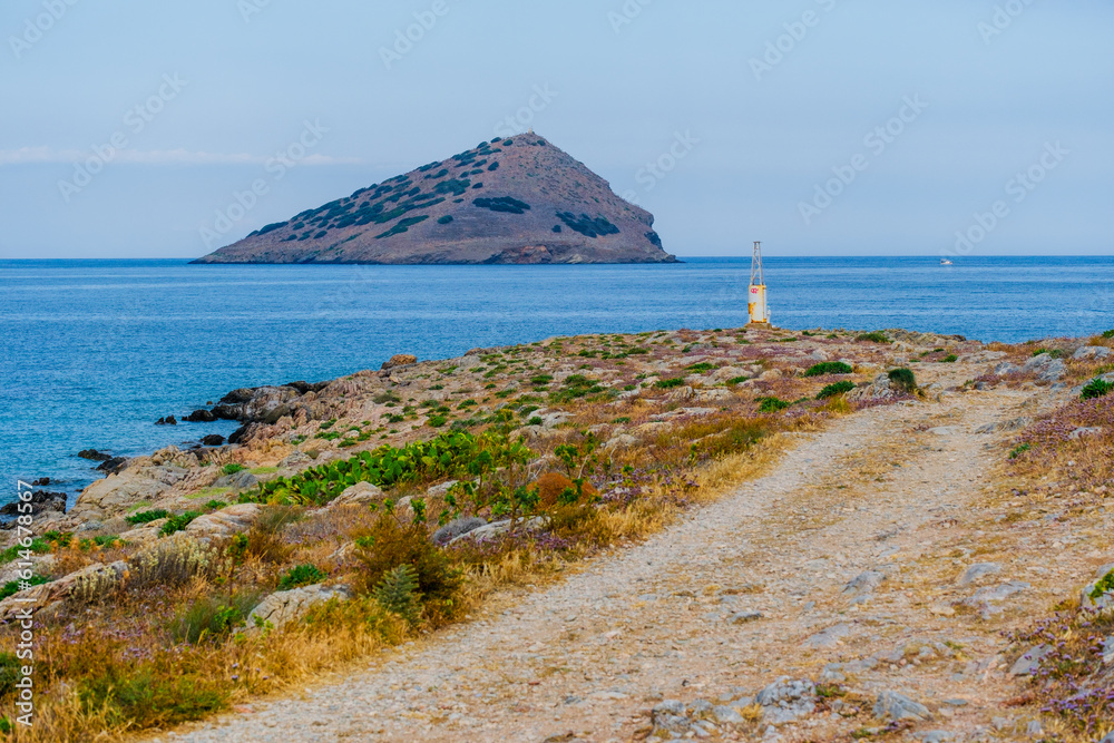 Wall mural rocky coast offshore with blue sea, greece