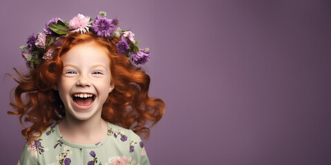 Adorable ginger little girl wearing flowers in her hair. Isolated on purple background 