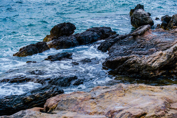 Rocky coast offshore with blue sea, Greece