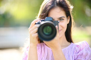 Happy photographer taking picture of you