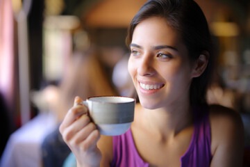 Happy woman enjoying holding coffee cup