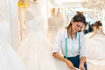 Portrait of entrepreneur bridal shop owner business woman fashion designer stylish...