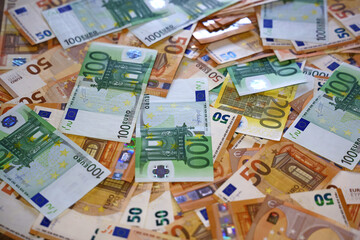 Obraz na płótnie Canvas Euro banknotes on the table. Close up of euro cash money background, concept of finance and good earnings