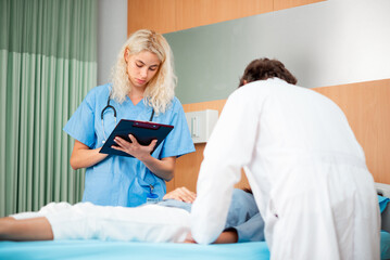 Fototapeta premium Doctors and nurses visit patients in the recovery room in the hospital to provide assistance after surgery.