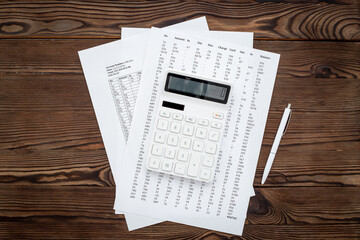 Business accounter working place with taxes and calculator