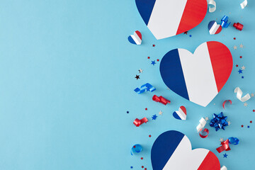 Party concept for celebrating Bastille Day on July 14th. Top view arrangement of hearts in...