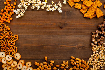 Frame of many salty snacks top view. Fast food background