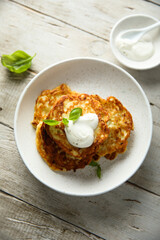 Traditional homemade latkes with sour cream