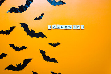 Flat lay halloween. The bats. Halloween inscription from wooden letters