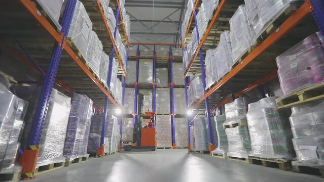 Large modern warehouse with goods without people. As the measure moves through the warehouse of the factory. Modern warehouse, industrial interior
