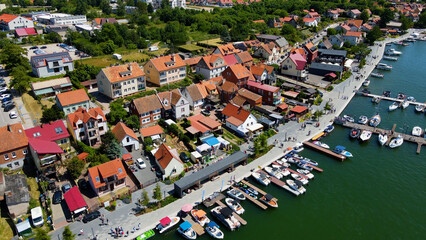 Panoramic aerial photo from drone to Mikolajki townscape - capital of Masurian region on the shore...