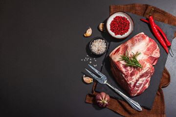 Raw pork loin with spices and herbs. Fresh meat cut, ingredient for cooking protein food