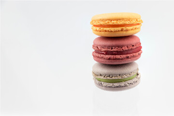 three macaroons on a white background