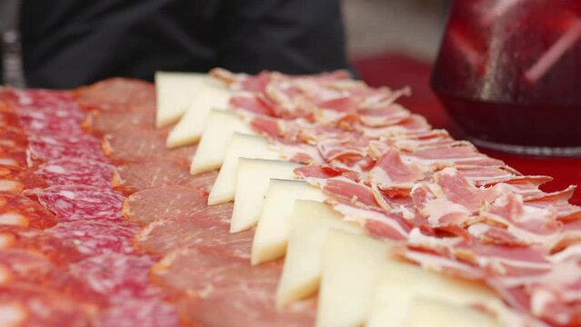 Cheese And Cold Meat Platter Served On The Table. - close up