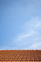 Red roof top and blue sky