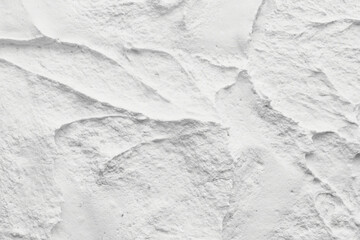 Decorative white putty background. Wall texture with filler paste applied with spatula, chaotic dashes and strokes over plaster.