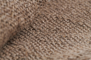 Linen crumpled texture natural fabric background closeup