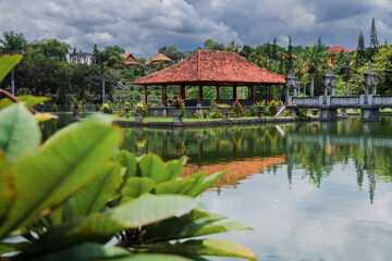 Taman Ujung in Bali, Indonesia. Balinese architecture with lake