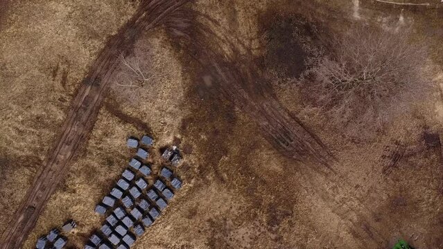 Drone shot moving over the mass buriel site at the Church of Saint Andrew and Pyervozvannoho All Saints. Ukraine, Bucha - Kyiv Oblast.