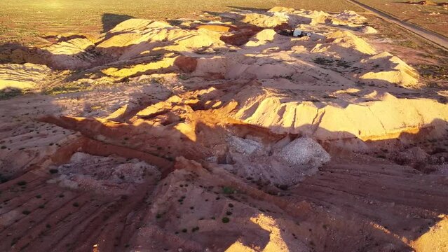 Drone shot in afternoon sun over the Coober Pedy Opal mining fields in outback South Australia.
