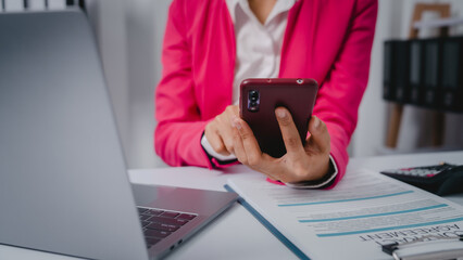 Fototapeta premium Excited Asian bookkeepers doing bookkeeping, accounts payable, assets, book value, equity, inventory, liabilities, cost of goods sold, depreciation, expenses, Gross profit, diversification, liquidity