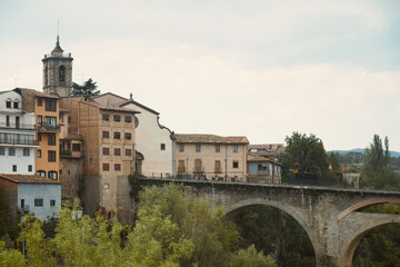 Village of Roda de Ter with the parish church of Sant Pere de Roda de Ter. Villages of Catalonia. River Ter in Osona, Province of Barcelona.