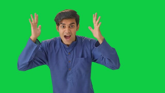 Frustrated Indian man shouting Green screen
