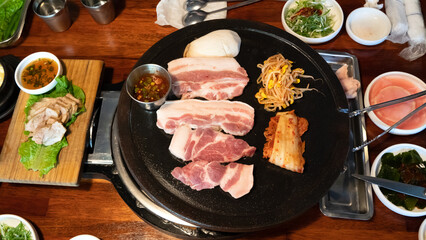 Fresh and delicious iron pan-fried black pork meal in Jeju Korean restaurant.