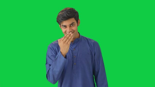 Indian muslim man doing Adaab and greetings Green screen