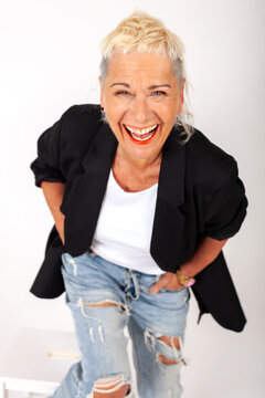 Portrait of amused fashionable senior woman