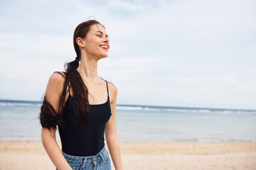 Fototapeta na wymiar sea woman smile running beach travel young summer sunset leisure lifestyle